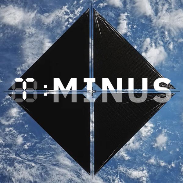 a rendering of a large, kite-like solar sail flying over the Earth from the perspective of space. The T-Minus logo is over the image.