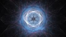 Circular abstract pattern with intricate, intertwined blue and white swirling lines forming a radiant, symmetrical design against a dark background.